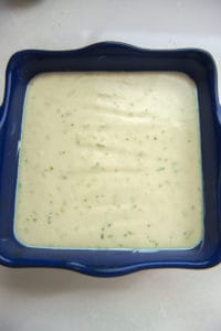 key lime pie bars in a 9 x 9 inch square baking dish